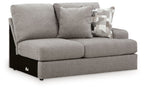 Smoke gray loveseat with two seat cushions, arms, and patterned throw pillow