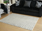 Turinwith rug, beige with dark grid lines, rectangular on hardwood floor