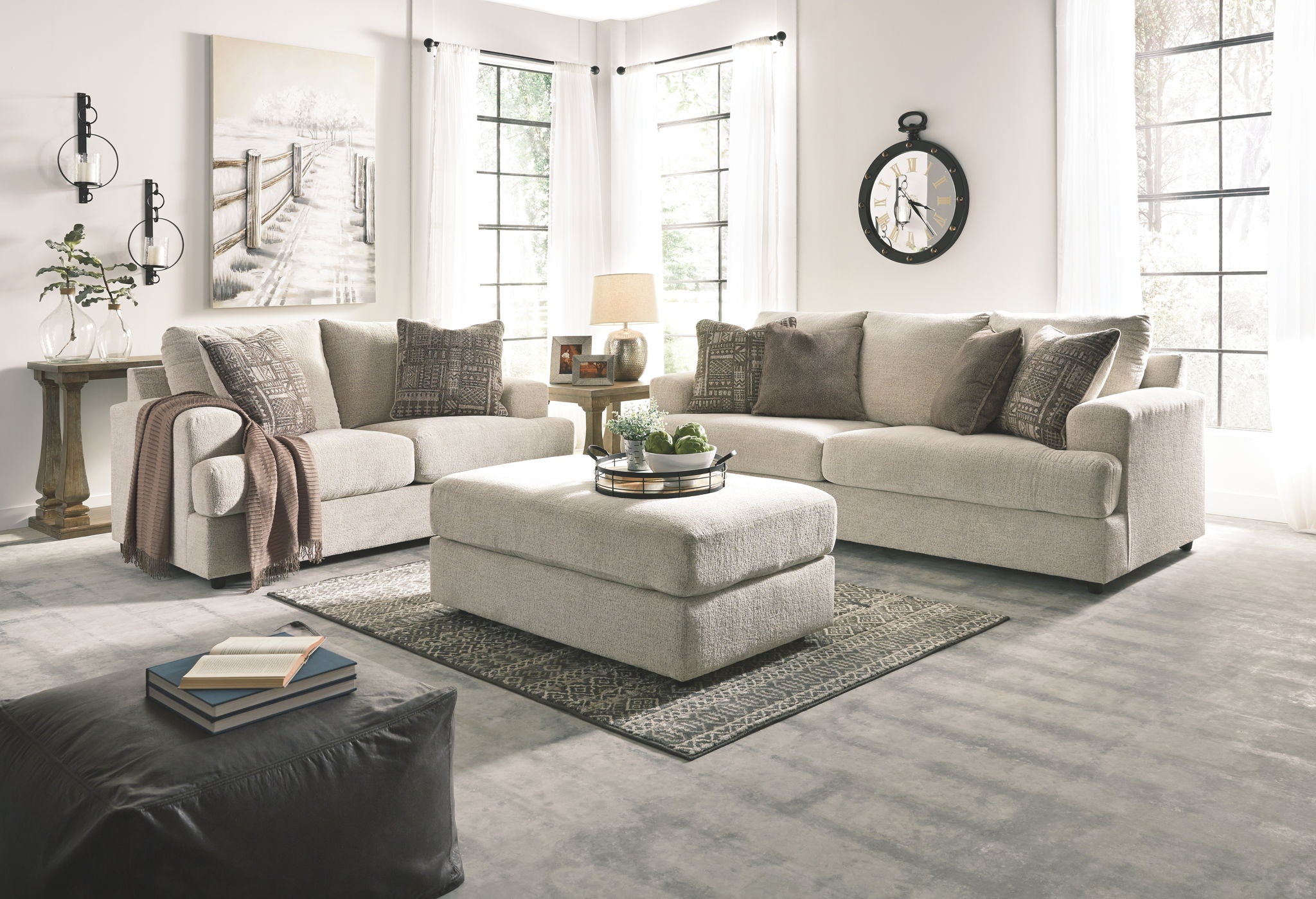 Stone upholstered sofa and loveseat with decorative accent pillows