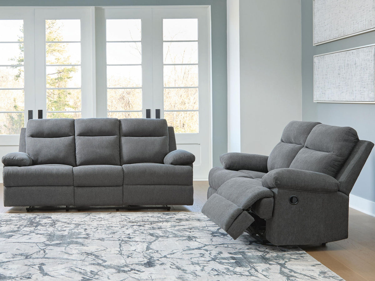 Reclining living room set with gray sofa and matching recliner chairs