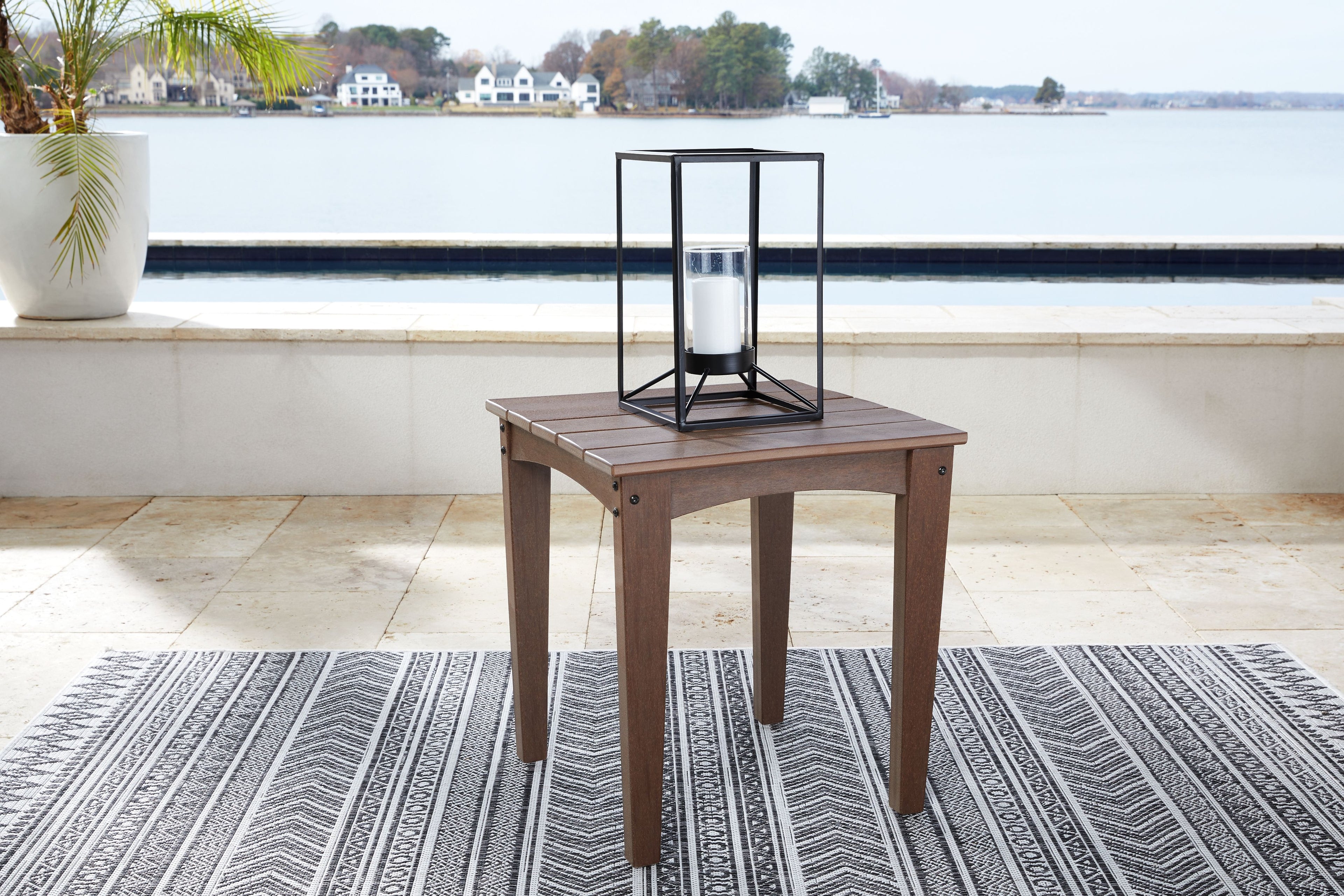 Brown square end table with slatted top and metal lantern on top
