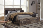 Panel bed with storage drawers, dark gray wood-look finish, angled front view of footboard