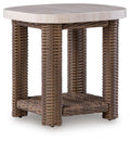 Square end table with beige top and brown woven wicker legs and lower shelf.