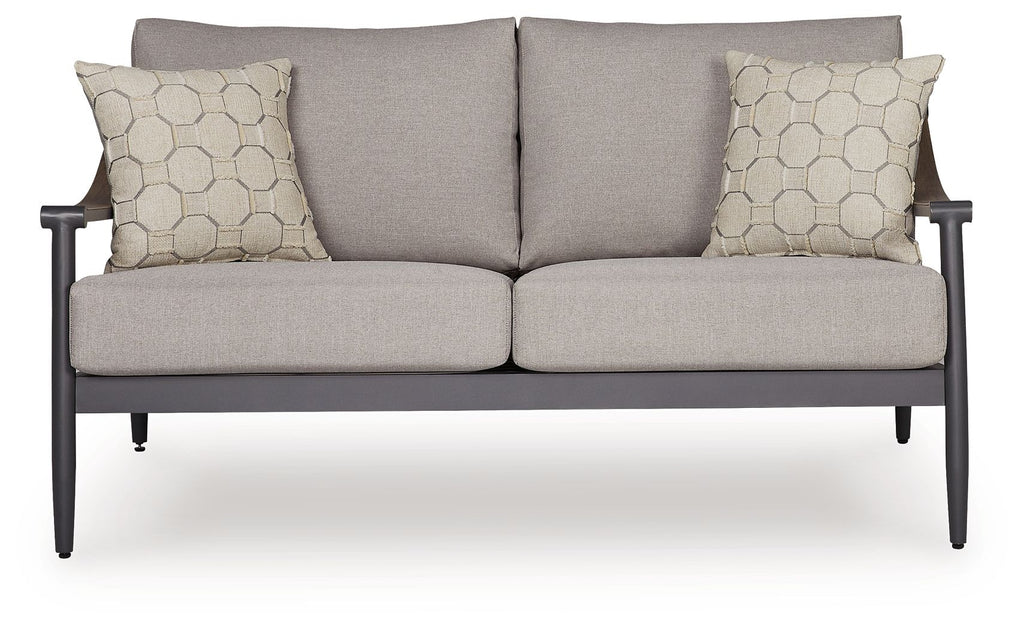 Gray loveseat with two seat cushions and two square hex-pattern throw pillows