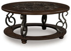 Dark brown round cocktail table with marble top, wrought-iron scroll legs, 2 tiers