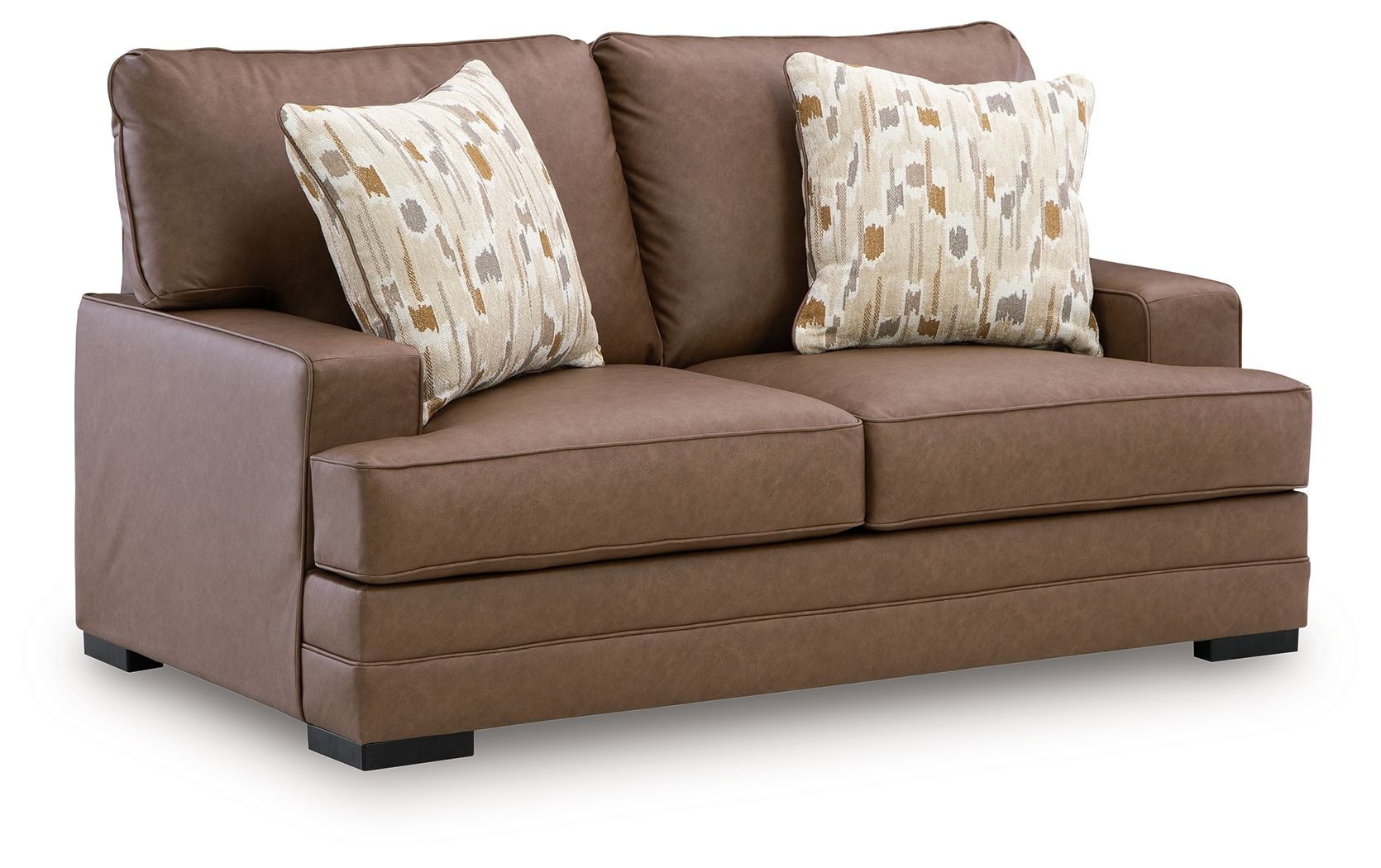 Caramel-brown loveseat with two patterned throw pillows