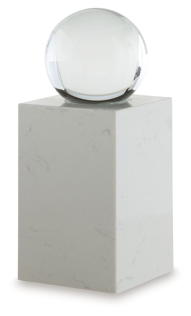 White glass sphere on white marble pedestal, front three-quarter view