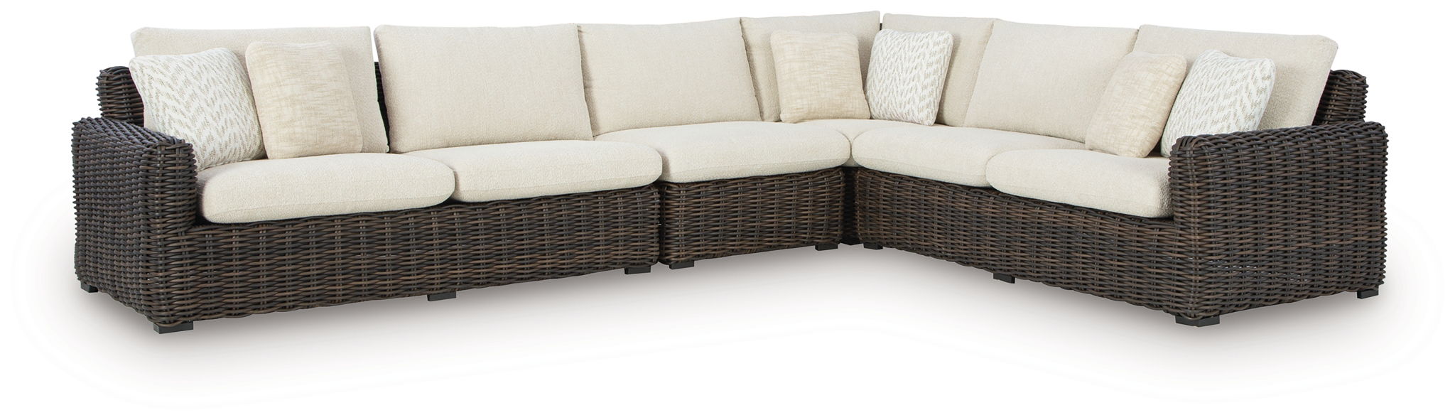 L-shaped outdoor sectional with dark brown wicker and beige seat cushions