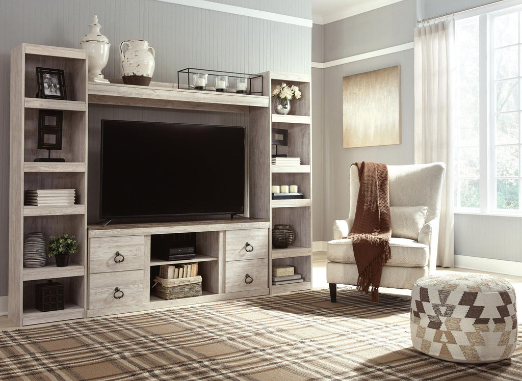 Whitewash entertainment center with TV console, open shelves, and drawer storage