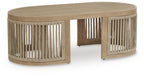 Beige cocktail table with circular top and slatted pedestal base