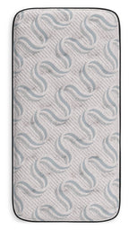 Gray mattress cover with wavy quilted pattern and black fabric edging