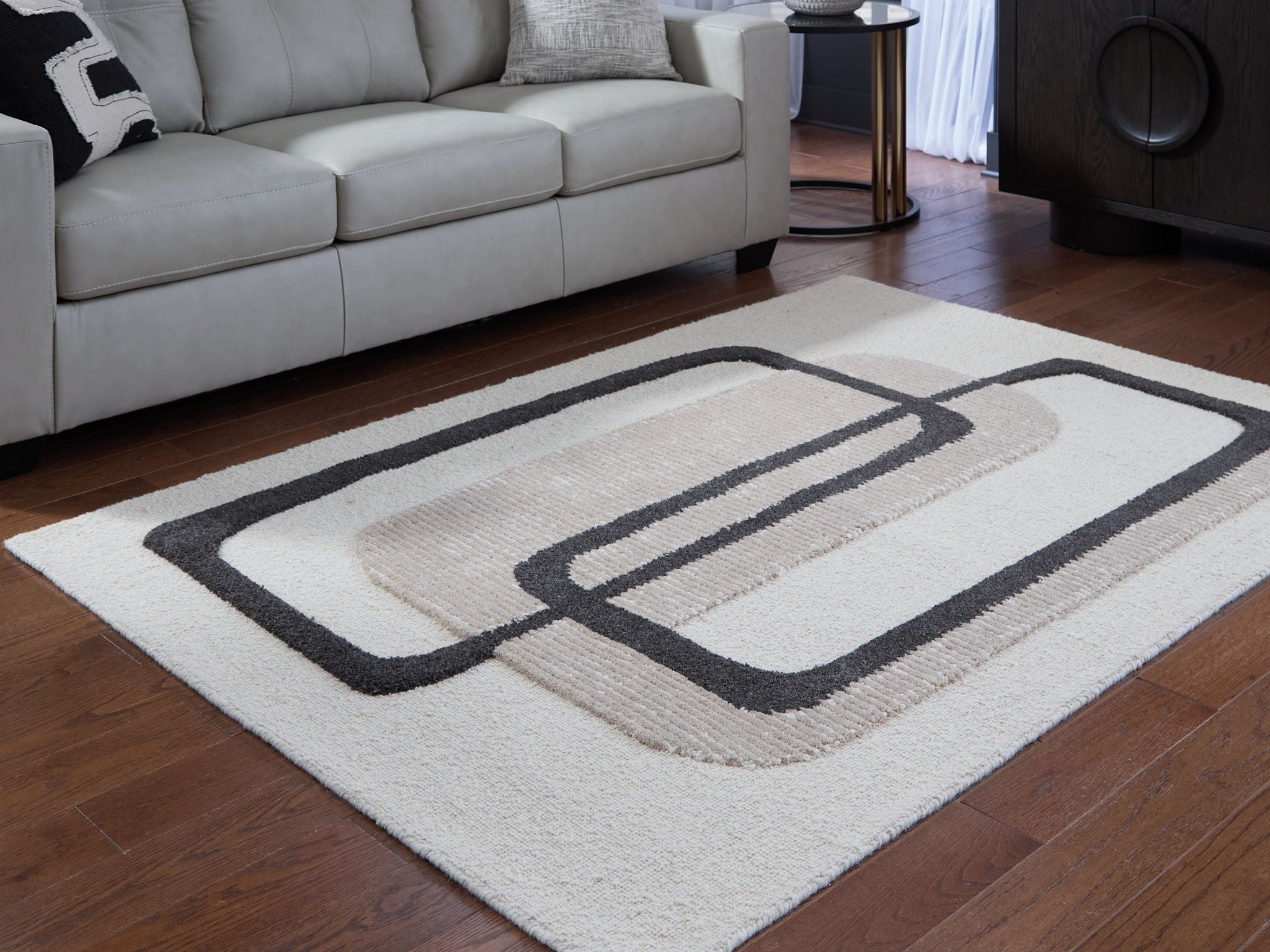 Beige rug with black geometric rectangles pattern