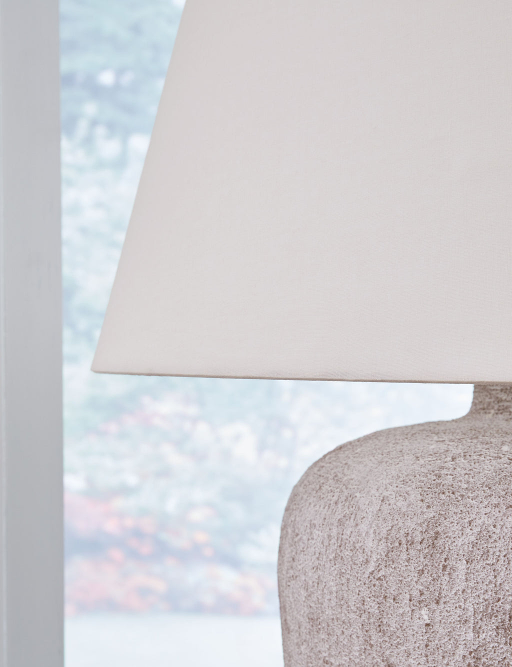 White drum table lamp shade with top of textured gray base