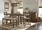 Beige upholstered bench with nailhead trim and dark wood legs