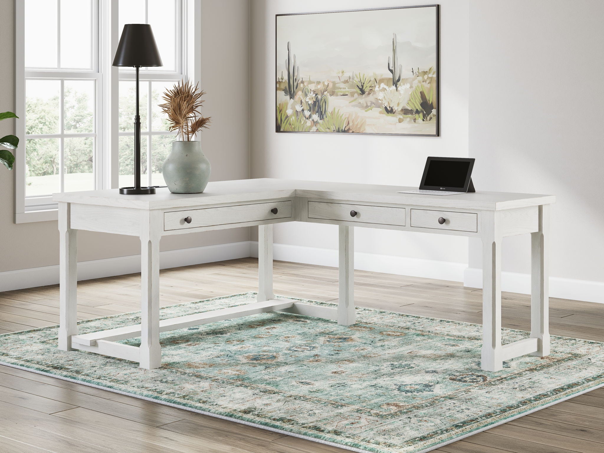 White corner writing desk with drawers and open shelf, shown with office accessories