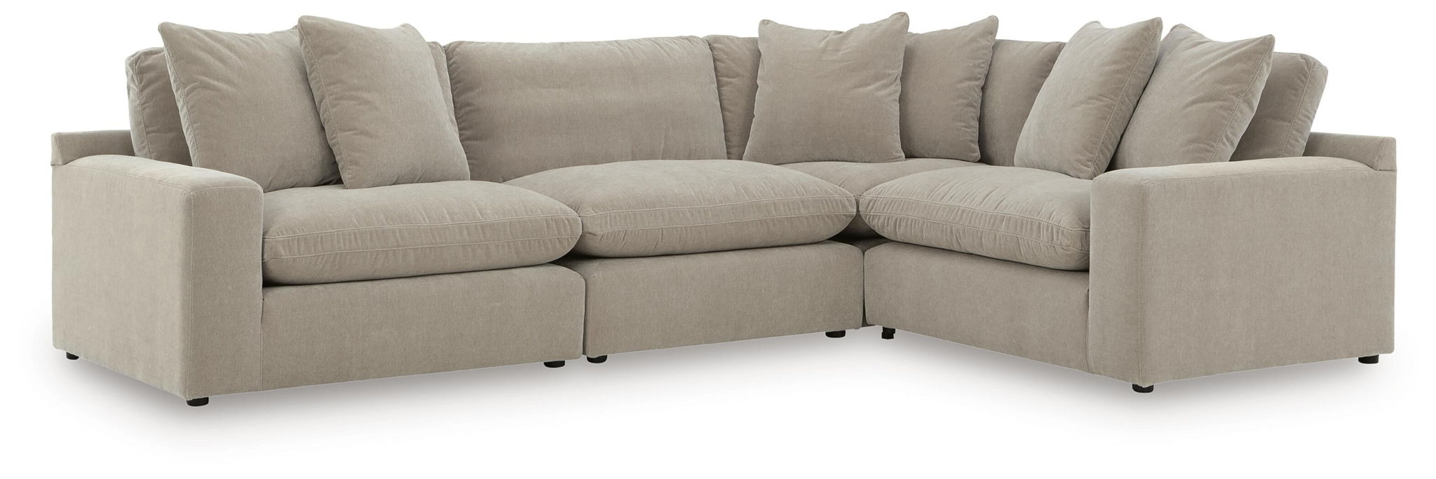 Light gray sectional sofa with deep seating, square arms, and back cushions along the curve.