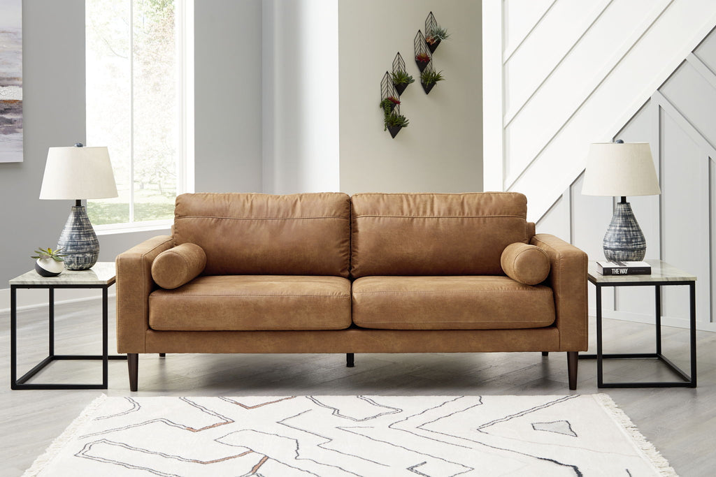 Light brown upholstered sofa with rounded arms, bolster back cushions, and tapered legs