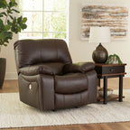 Dark brown rocker recliner chair with tufted back cushions and wide padded arms