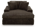 Oversized chaise with ribbed dark gray fabric, two back cushions and plush seat back.