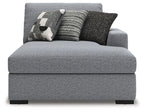 Gray RAF corner chaise with upholstered backrest and three decorative pillows in black and white