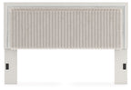 Upholstered panel headboard with corded tufted bottom edge and vertical texture