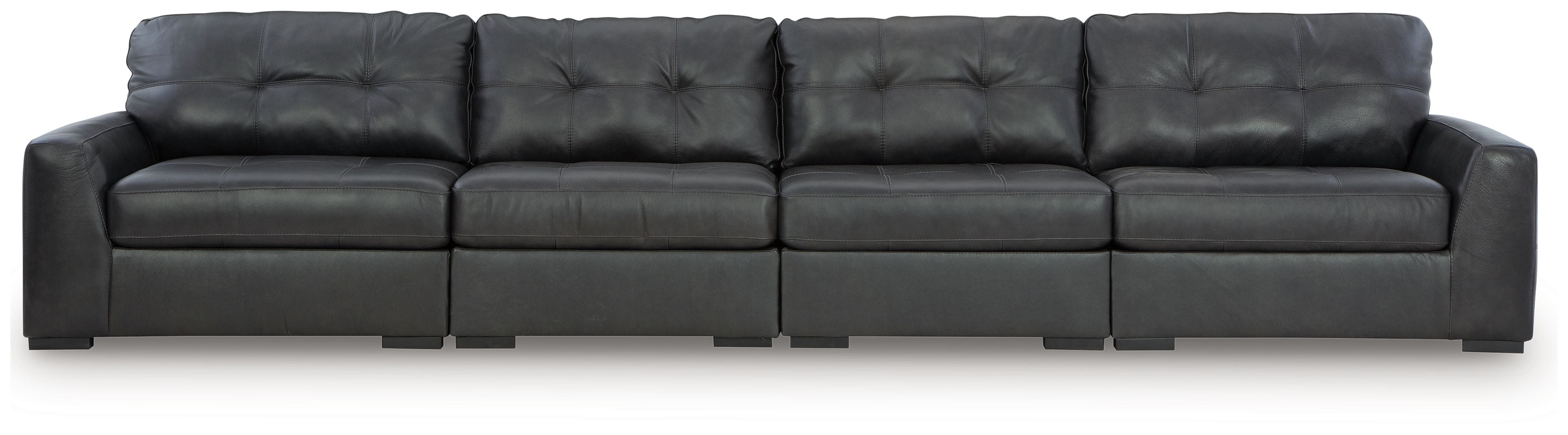 Four-seat sectional sofa with tufted back panels and wide, squared arms
