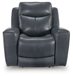 Blue leather-look power recliner with adjustable headrest and cushioned backrest