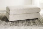 Beige fabric accent ottoman with padded top cushion
