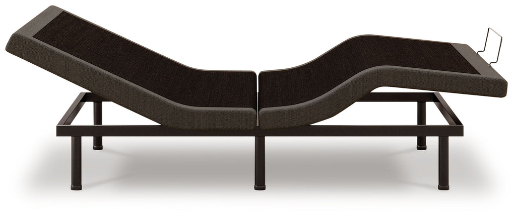 Adjustable bed base, black upholstery, side view showing adjustable segments and legs