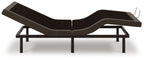 Adjustable bed base, black upholstery, side view showing adjustable segments and legs