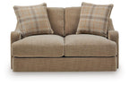 Beige loveseat with two plaid back pillows and two seat cushions, front close view