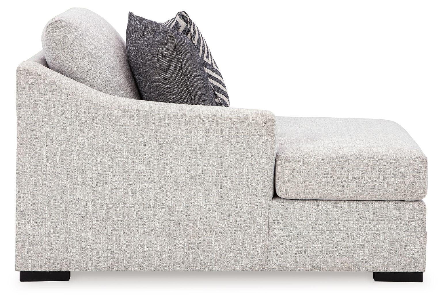 Stone gray chaise arm and seat cushion with dark patterned throw pillow