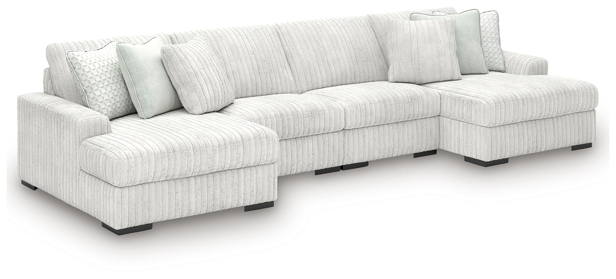 Off-white striped sectional sofa with corner chaise and low dark feet.