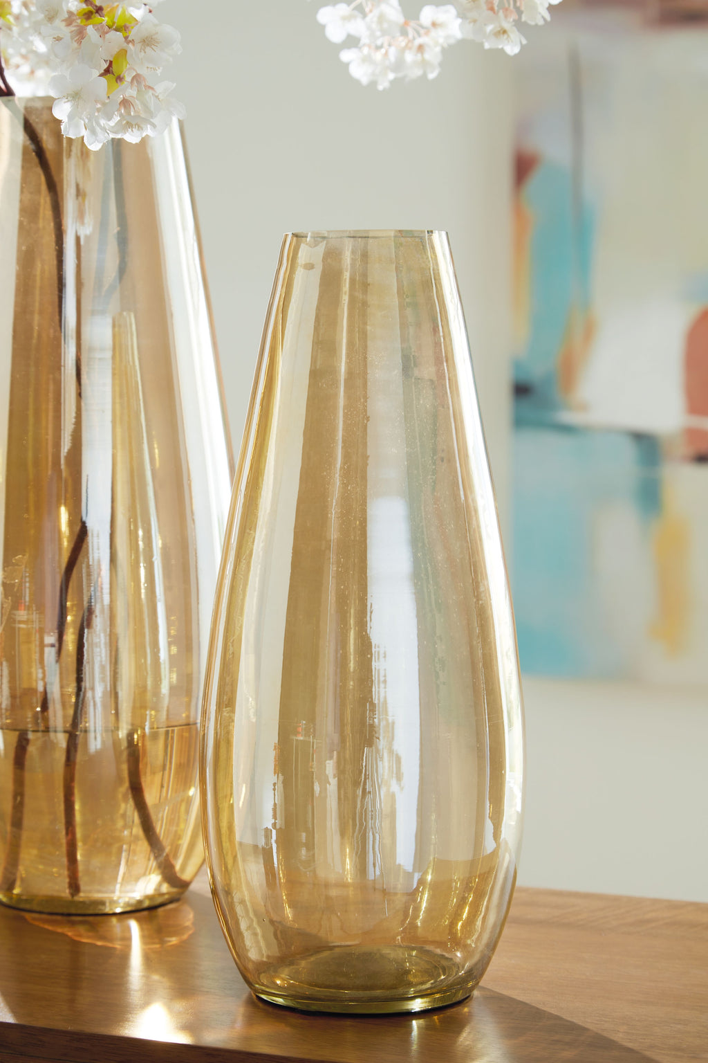 Amber glass vases with flared openings and vertical banding detail