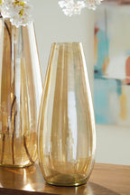Amber glass vases with flared openings and vertical banding detail