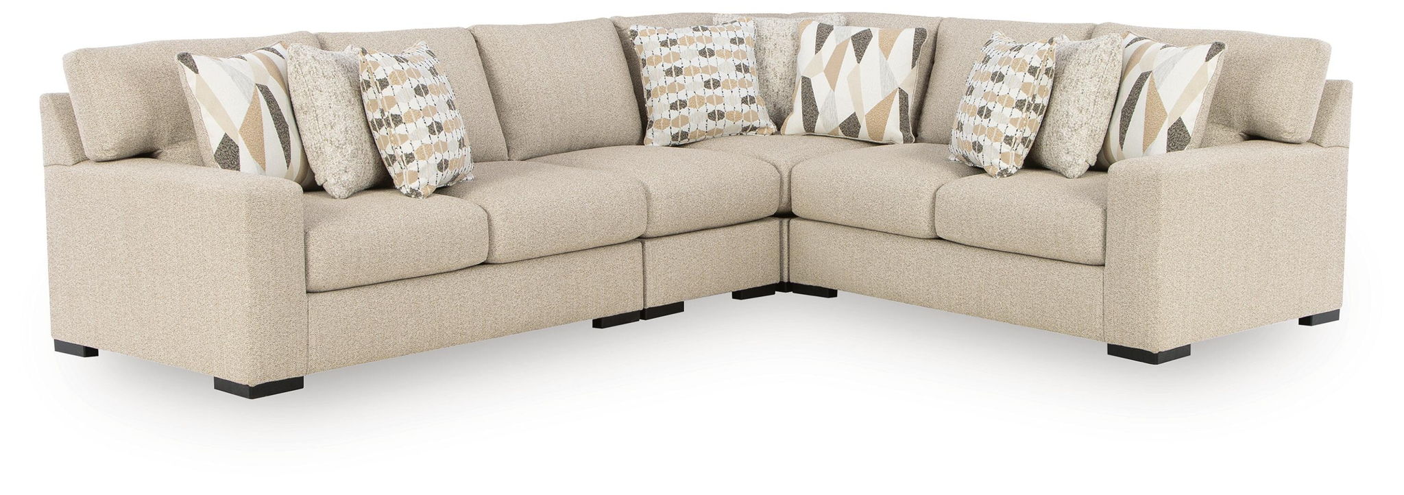 Laurelgrove corner sectional sofa in pebble fabric with tufted cushions and patterned pillows