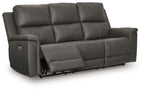 Dark gray power reclining sofa with padded armrests and adjustable headrests