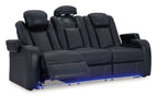 Power reclining sofa with adjustable headrests, dark navy upholstery, reclined seat