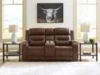 Power reclining loveseat with audio seating, brown upholstery, living room front view