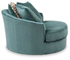 Teal upholstered swivel accent chair shown from side with thick rounded arms