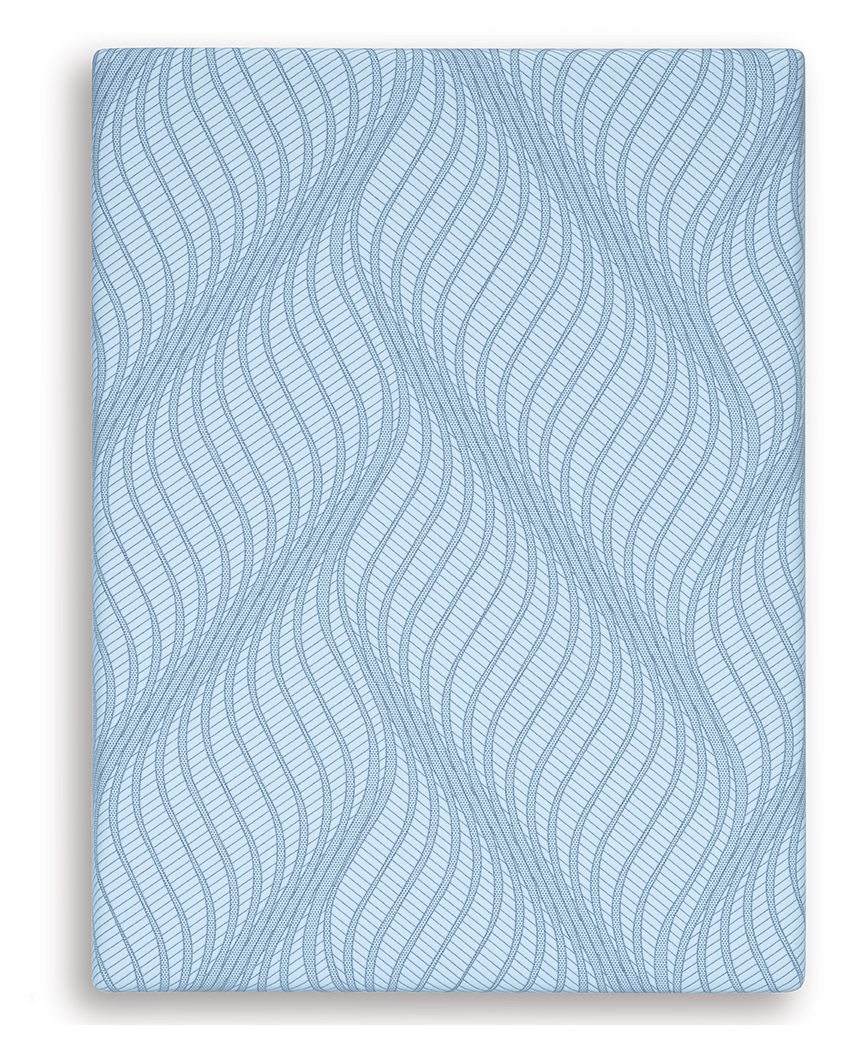 Blue memory foam mattress with wavy pattern cover, close-up