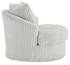 Swivel chair with ribbed light upholstery and two back cushions, angled side view
