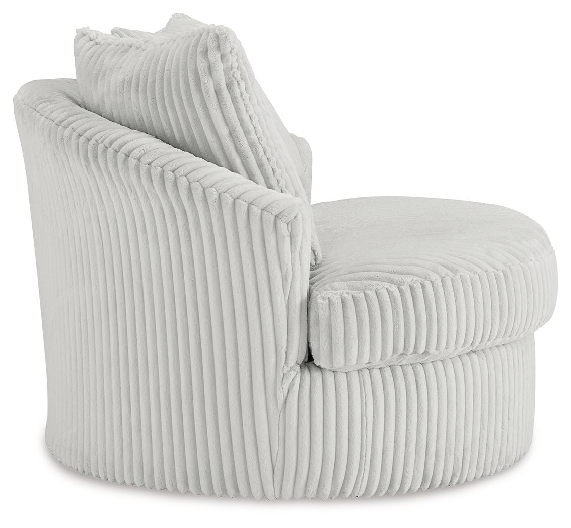 Swivel chair with ribbed light upholstery and two back cushions, angled side view