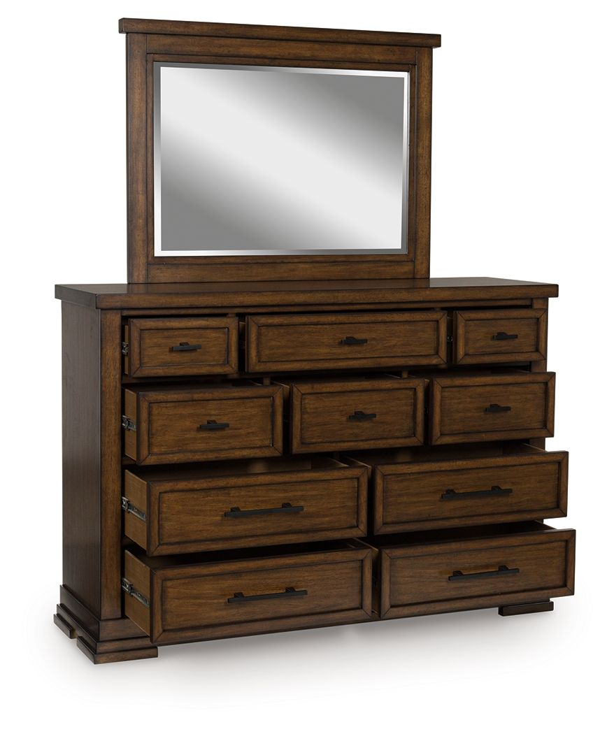 Medium brown dresser with mirror, stacked drawers and black pull handles