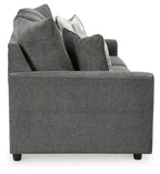 Dark gray fabric sofa with raised back and layered throw pillows.