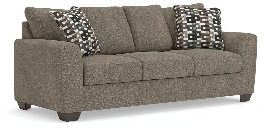 Queen sofa sleeper in gray suede with two patterned accent pillows