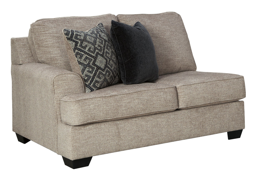 Stone gray loveseat with square arms and accent pillows on the seat