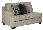 Stone gray loveseat with square arms and accent pillows on the seat