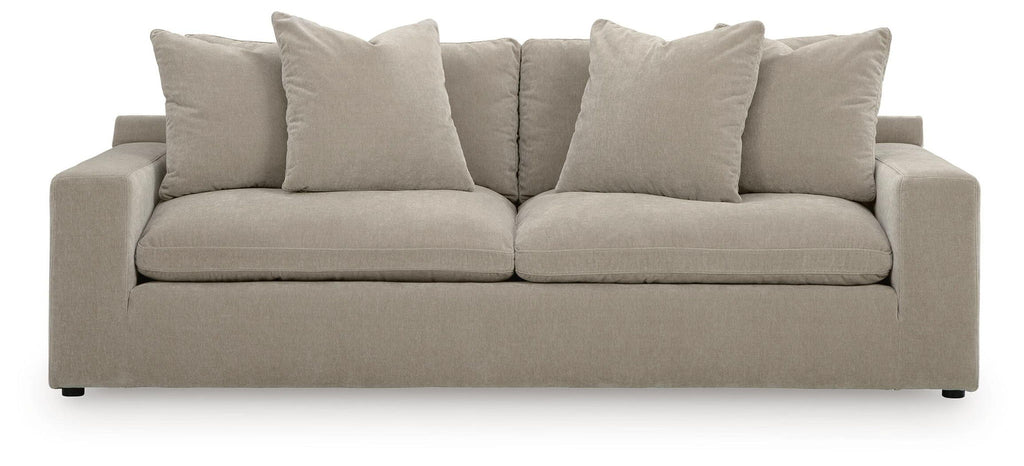 Light gray fabric sofa with three seat cushions and five back pillows, square arms