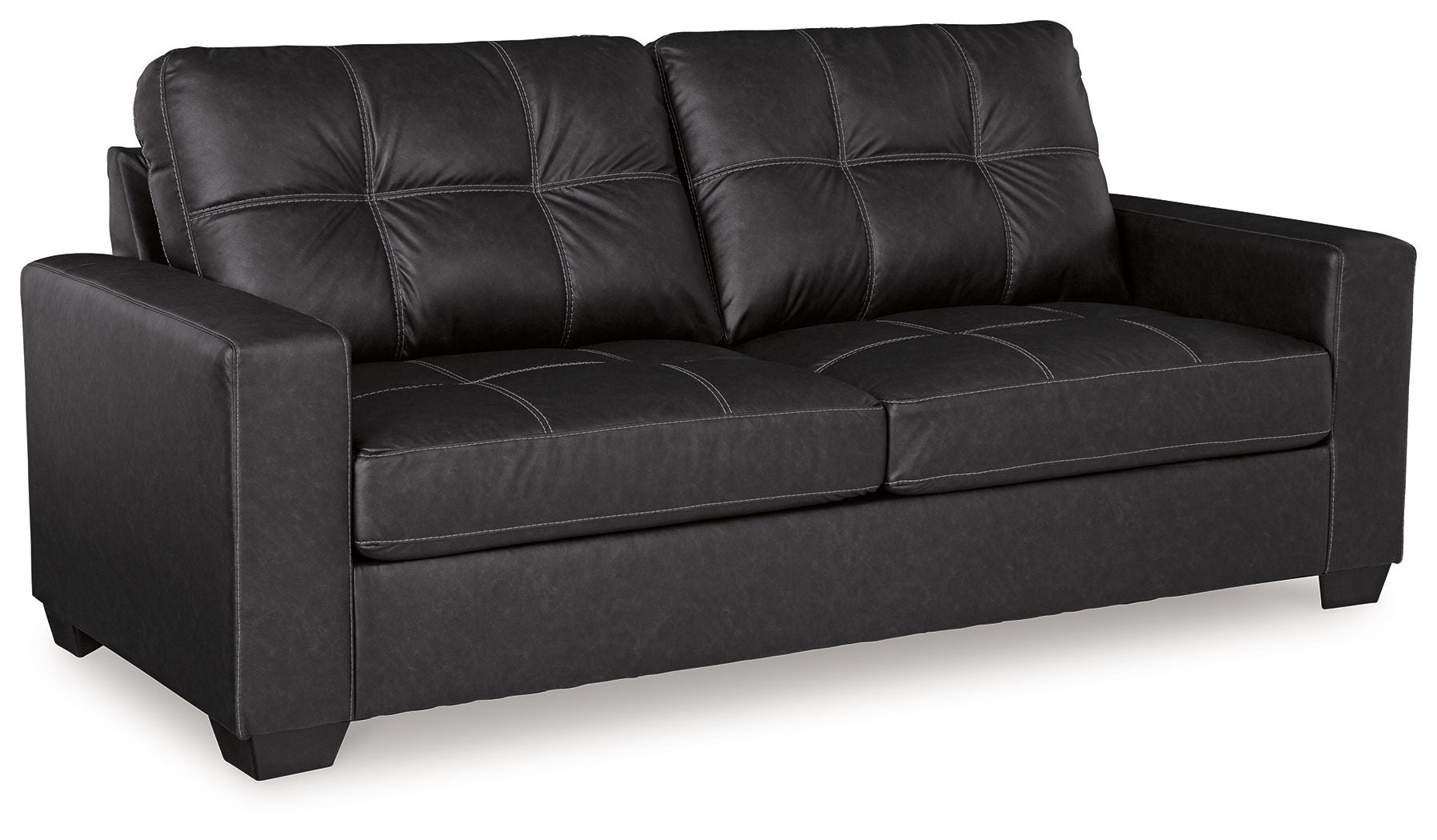 Black leather-look sofa with tufted back cushions and wide track arms